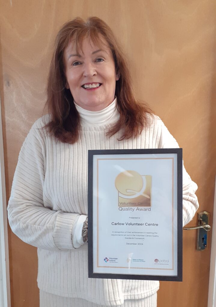 Manager Helen Rothwell holding the certificate